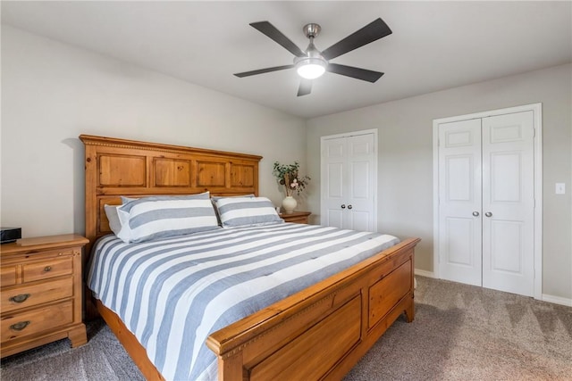 15 Serenity Ln, Holiday Island, AR 72631 - carpeted bedroom featuring two closets and a ceiling fan