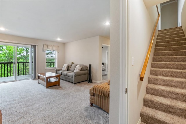 15 Serenity Ln, Holiday Island, AR 72631 - carpeted living area with stairway and recessed lighting