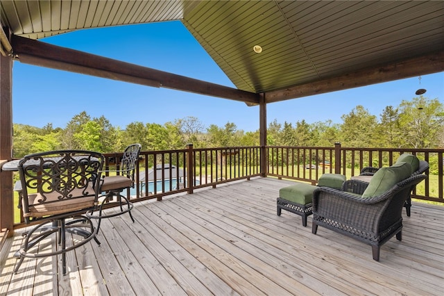 wooden deck with an outdoor pool