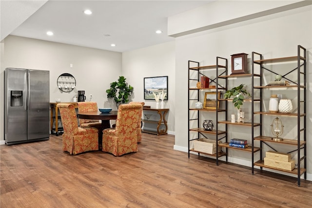dining area featuring recessed lighting, wood finished floors, and baseboards
