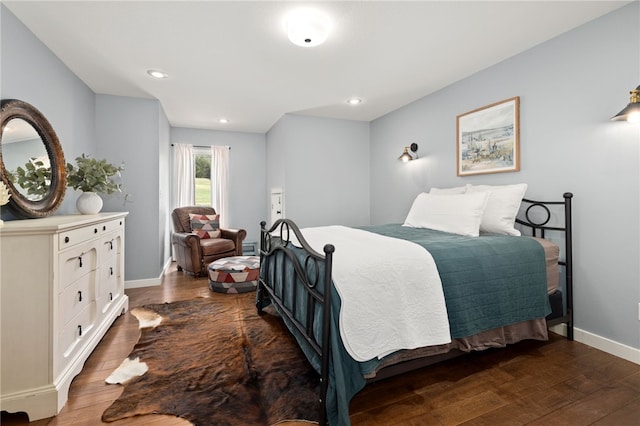 bedroom featuring recessed lighting, dark wood-style floors, and baseboards