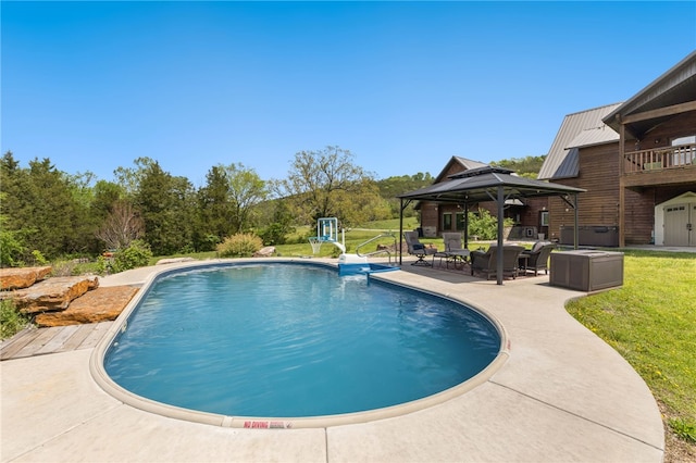 pool featuring a gazebo, a yard, and a patio
