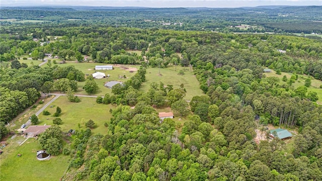 drone / aerial view featuring a forest view