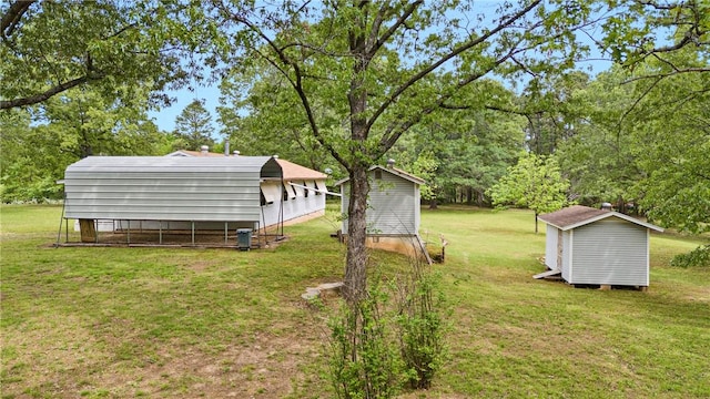view of yard with an outbuilding and a storage shed