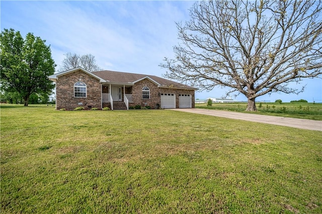 ranch-style house with driveway, covered porch, a front yard, brick siding, and a garage