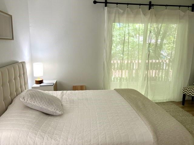 bedroom with wood finished floors