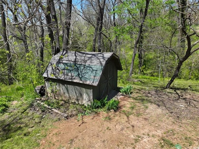 1010 Ashley Ln, Pea Ridge, AR 72751 - view of shed featuring a wooded view