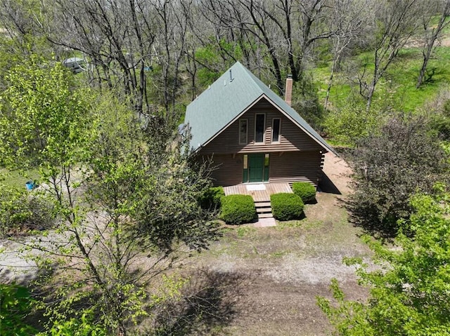 1010 Ashley Ln, Pea Ridge, AR 72751 - view of front of property with covered porch, a chimney, and a wooded view