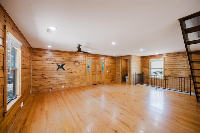 1010 Ashley Ln, Pea Ridge, AR 72751 - unfurnished living room featuring wood finished floors, wood walls, and recessed lighting