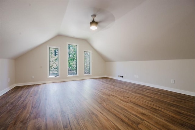 1010 Ashley Ln, Pea Ridge, AR 72751 - bonus room with dark wood finished floors, ceiling fan, vaulted ceiling, and baseboards