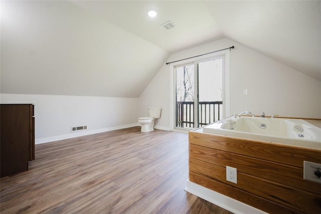 1010 Ashley Ln, Pea Ridge, AR 72751 - additional living space with vaulted ceiling, wood finished floors, and baseboards