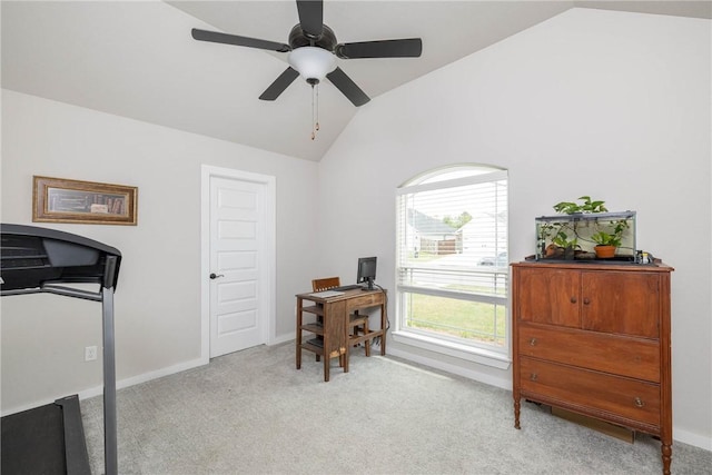 office featuring ceiling fan, vaulted ceiling, light carpet, and baseboards