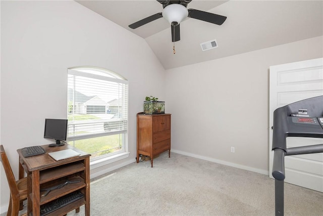 office area featuring lofted ceiling, light colored carpet, visible vents, ceiling fan, and baseboards