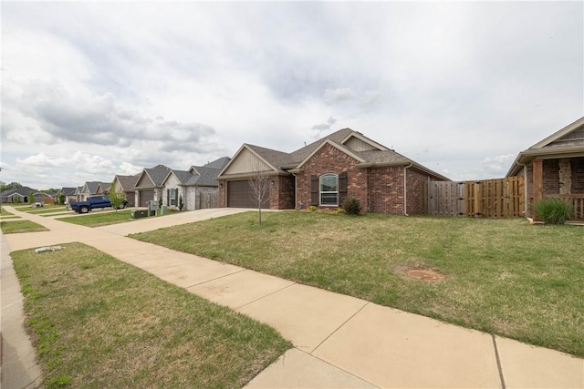 view of front of property with a front lawn, a gate, brick siding, concrete driveway, and an attached garage