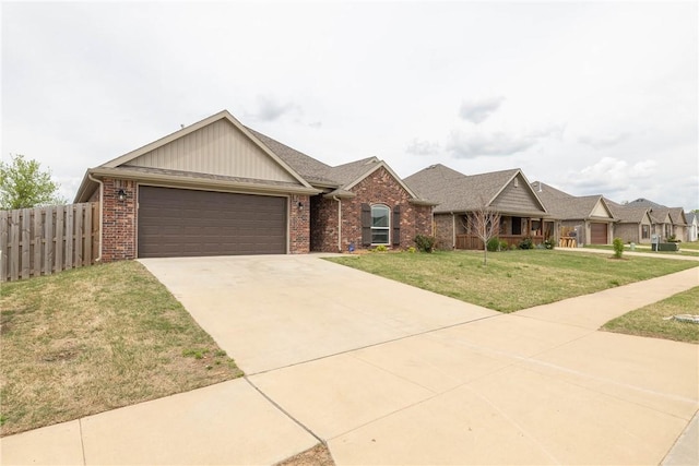 ranch-style home featuring concrete driveway, a front yard, an attached garage, fence, and brick siding