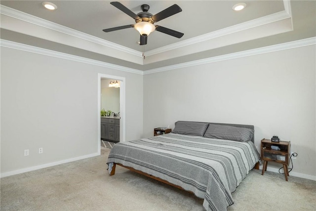 carpeted bedroom featuring ornamental molding, a ceiling fan, a raised ceiling, and baseboards