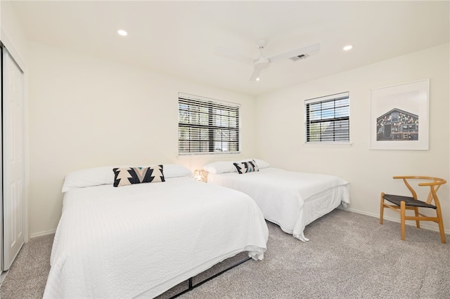carpeted bedroom featuring baseboards, recessed lighting, and visible vents
