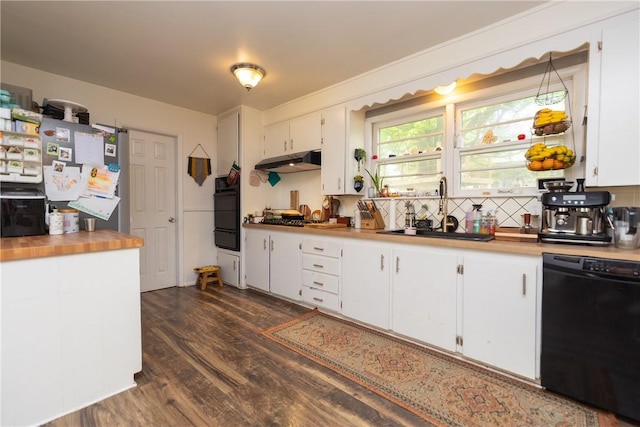 kitchen featuring a sink, light countertops, under cabinet range hood, dark wood-style floors, and black appliances