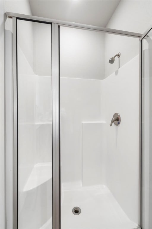 bathroom featuring a shower stall