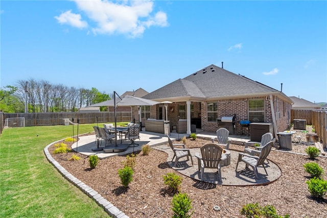 view of patio / terrace featuring a fenced backyard, an outdoor fire pit, and grilling area