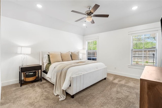 bedroom with recessed lighting, baseboards, light carpet, and a ceiling fan