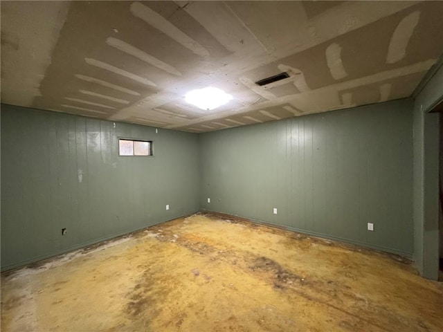below grade area featuring wooden walls