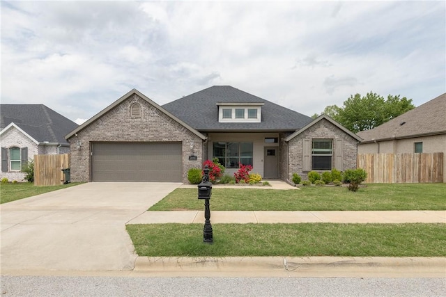 view of front of property featuring brick siding, an attached garage, fence, and concrete driveway