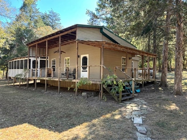 2525 Dustin Ln, Omaha, AR 72662 - rear view of property featuring a deck and a sunroom