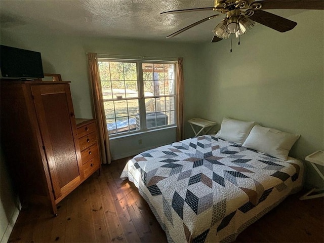 2525 Dustin Ln, Omaha, AR 72662 - bedroom with a ceiling fan, a textured ceiling, and hardwood / wood-style floors