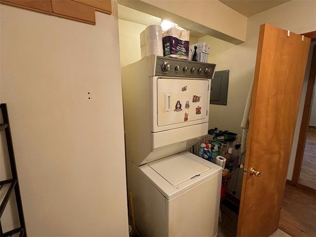 2525 Dustin Ln, Omaha, AR 72662 - interior space featuring laundry area, stacked washer and dryer, wood finished floors, and electric panel