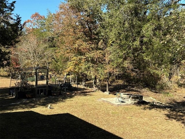 2525 Dustin Ln, Omaha, AR 72662 - view of yard featuring a fire pit