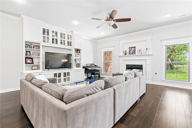 living room with crown molding, baseboards, recessed lighting, and dark wood-type flooring