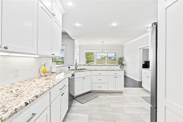 kitchen featuring backsplash, crown molding, a sink, a peninsula, and recessed lighting