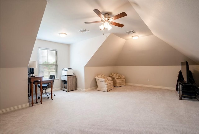 office area featuring visible vents, a ceiling fan, carpet, and lofted ceiling