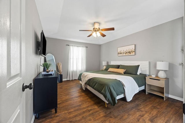 bedroom with baseboards, ceiling fan, and wood finished floors