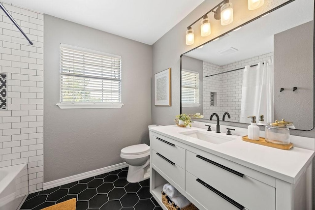 full bathroom with tile patterned flooring, baseboards, toilet, and vanity