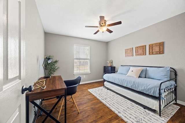 bedroom with dark wood-style flooring, baseboards, and ceiling fan