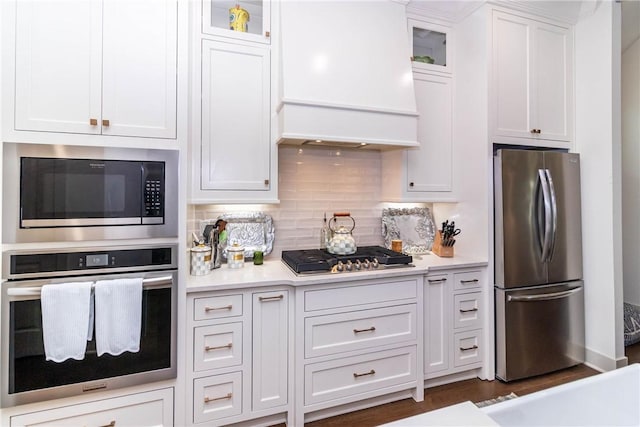 6761 Somerset Pl, Springdale, AR 72762 - kitchen with light countertops, white cabinets, appliances with stainless steel finishes, and premium range hood