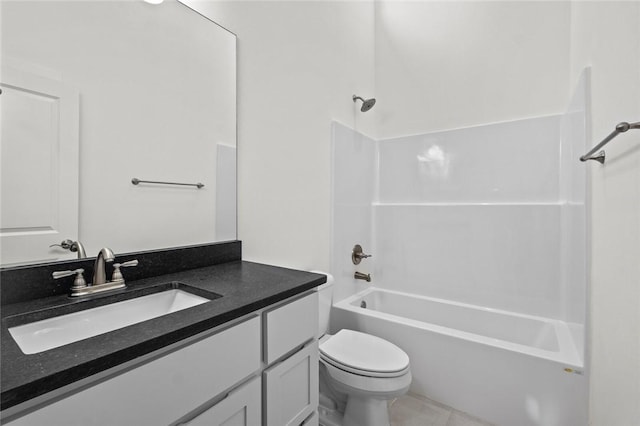 bathroom with vanity, toilet, tile patterned flooring, and bathtub / shower combination