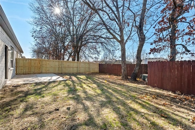 view of yard with a fenced backyard