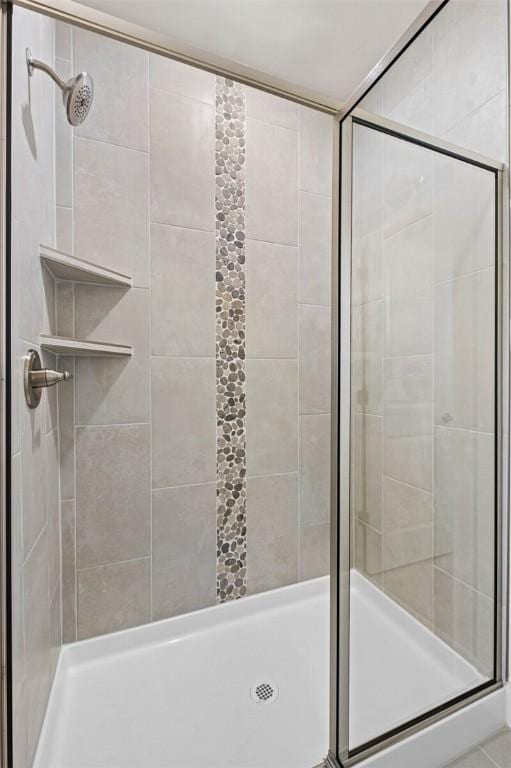 bathroom with a shower stall