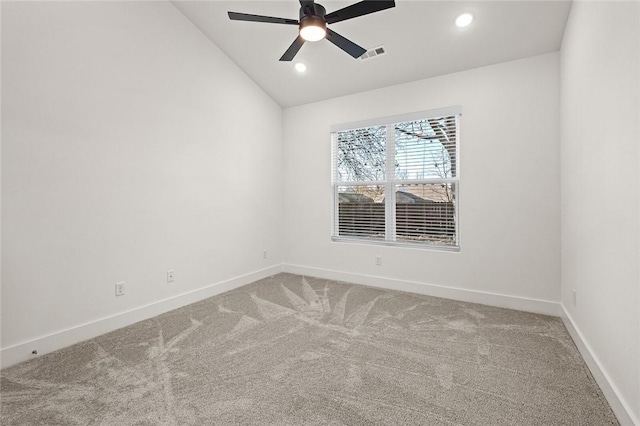carpeted empty room featuring baseboards, visible vents, ceiling fan, and vaulted ceiling