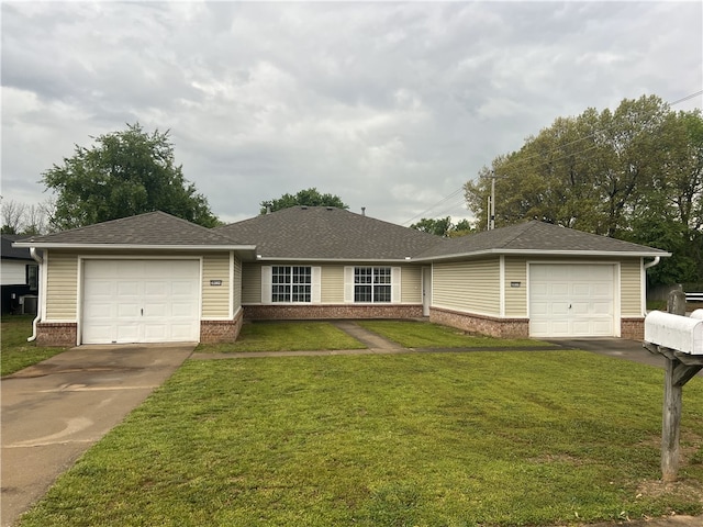 ranch-style house with driveway, brick siding, a front lawn, an attached garage, and a shingled roof