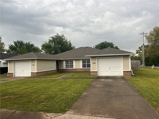 single story home with a garage, a front lawn, brick siding, and aphalt driveway