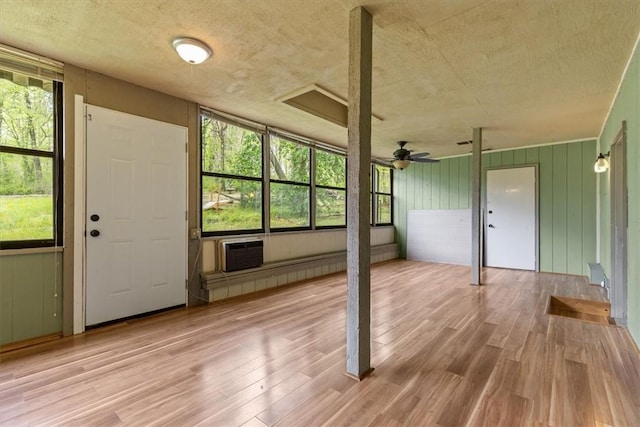 5 Sorbie Dr, Bella Vista, AR 72715 - entryway featuring wood finished floors, ceiling fan, a textured ceiling, plenty of natural light, and a wall mounted air conditioner