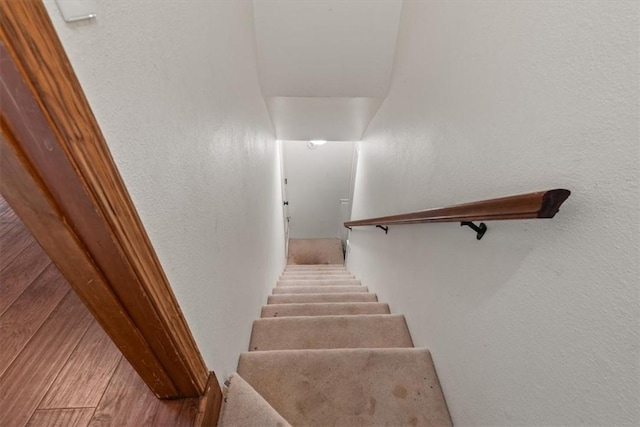 5 Sorbie Dr, Bella Vista, AR 72715 - stairs featuring a textured wall and wood finished floors