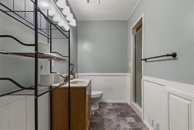 5 Sorbie Dr, Bella Vista, AR 72715 - full bathroom with wainscoting, a stall shower, vanity, and stone finish flooring
