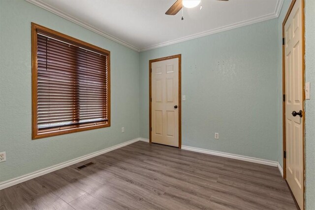 5 Sorbie Dr, Bella Vista, AR 72715 - unfurnished bedroom with wood finished floors, ornamental molding, and ceiling fan