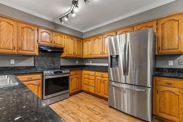 5 Sorbie Dr, Bella Vista, AR 72715 - kitchen featuring stainless steel appliances, under cabinet range hood, brown cabinets, light wood-style floors, and ornamental molding