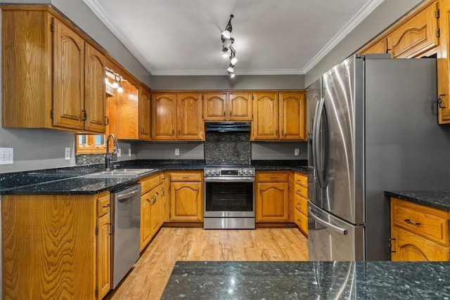 5 Sorbie Dr, Bella Vista, AR 72715 - kitchen featuring stainless steel appliances, brown cabinets, light wood finished floors, crown molding, and under cabinet range hood